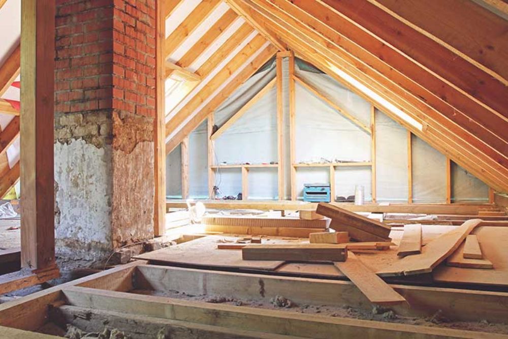 Interior view of a room with a wooden roof and wooden floor, showcasing a rustic and inviting design.